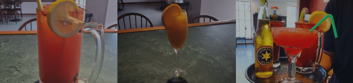 A row of cocktails, a michelada and a margarita on the bar.